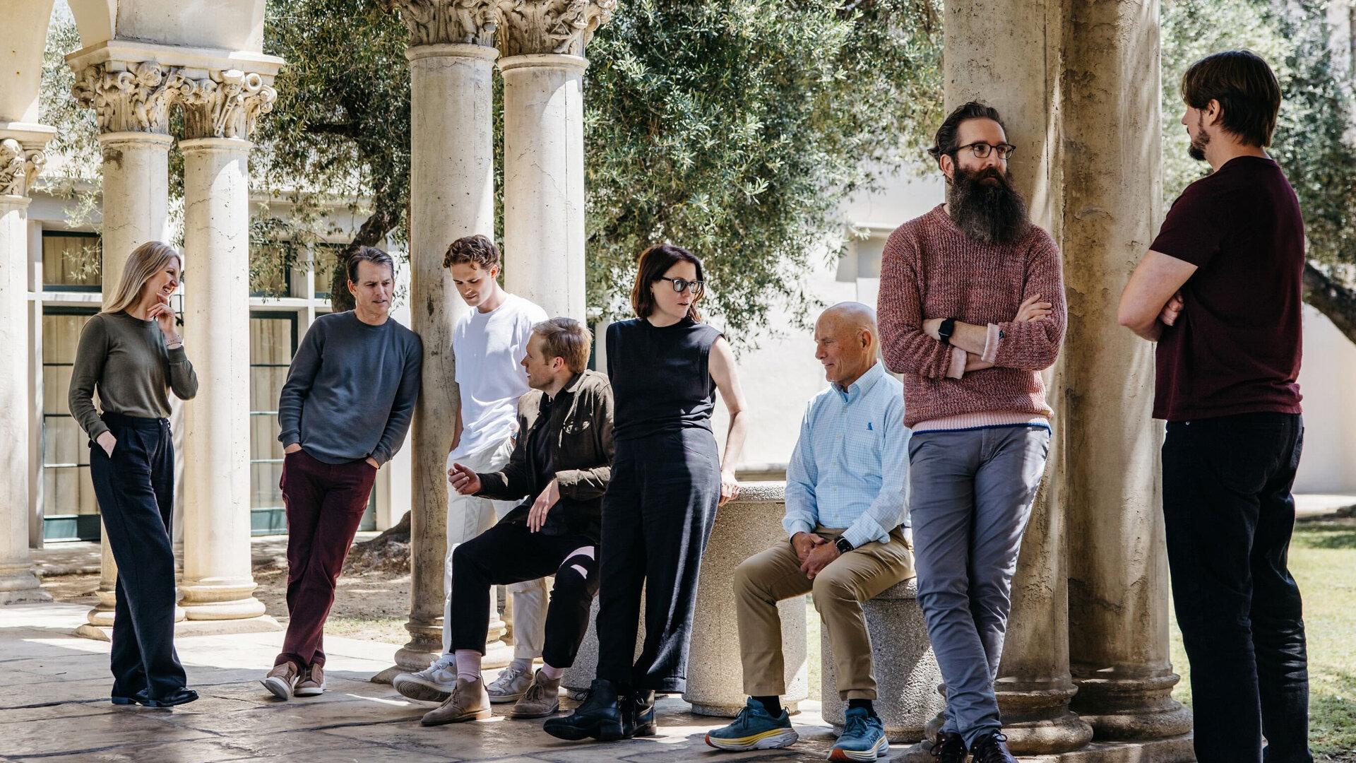 Laude Team standing in a pavillion